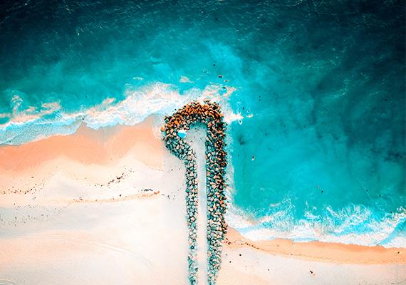 Rocky Jetty off the City beach coastline in Perth, Australia  /  © Ruud Bloemhof